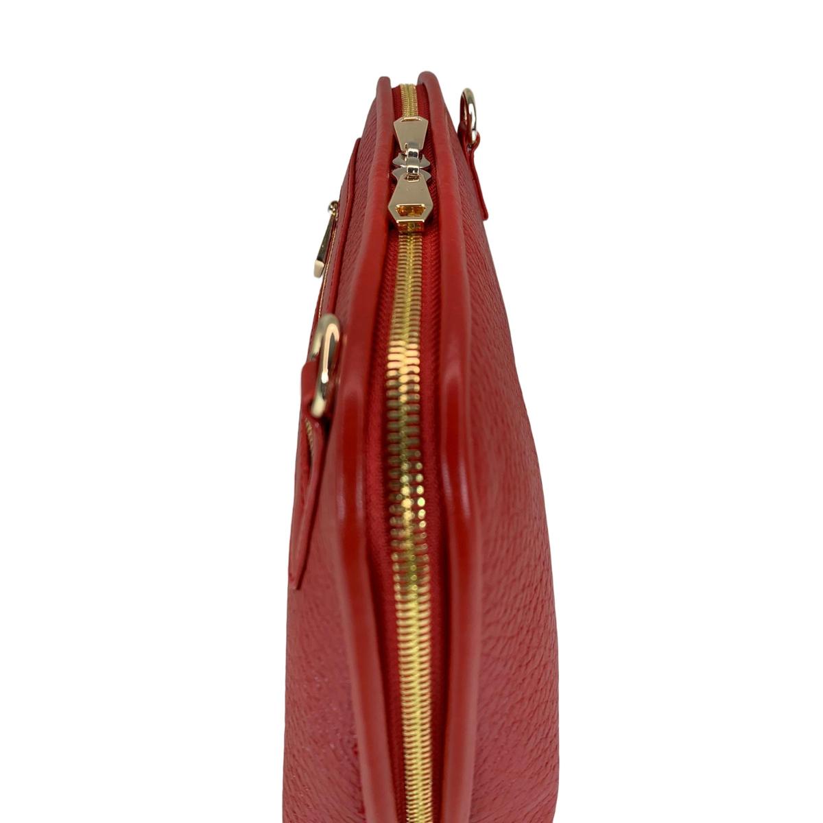 Red leather shoulder bag worn as crossbody style demonstration