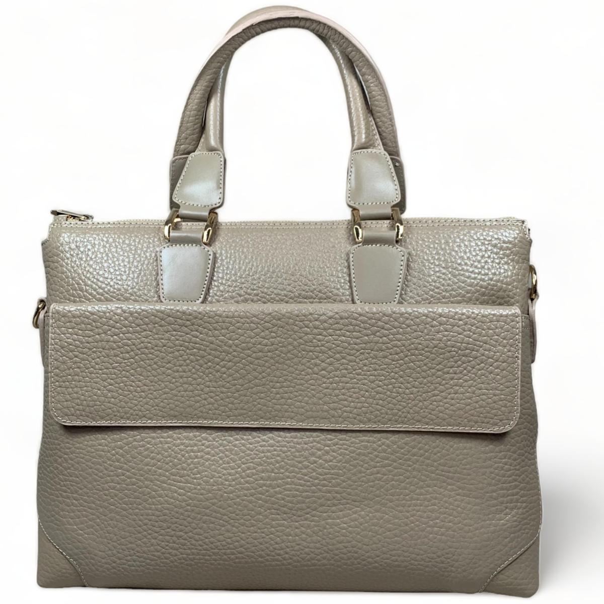 Full front view of cream leather laptop bag highlighting the clean lines and minimalist design