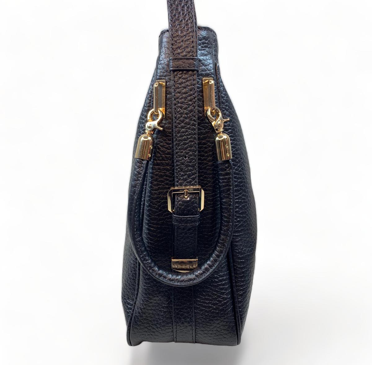 Detachable adjustable shoulder strap with gold hardware, detail shot