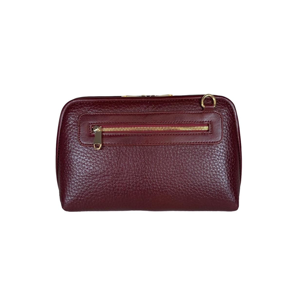 Premium real leather texture close-up on red clutch bag