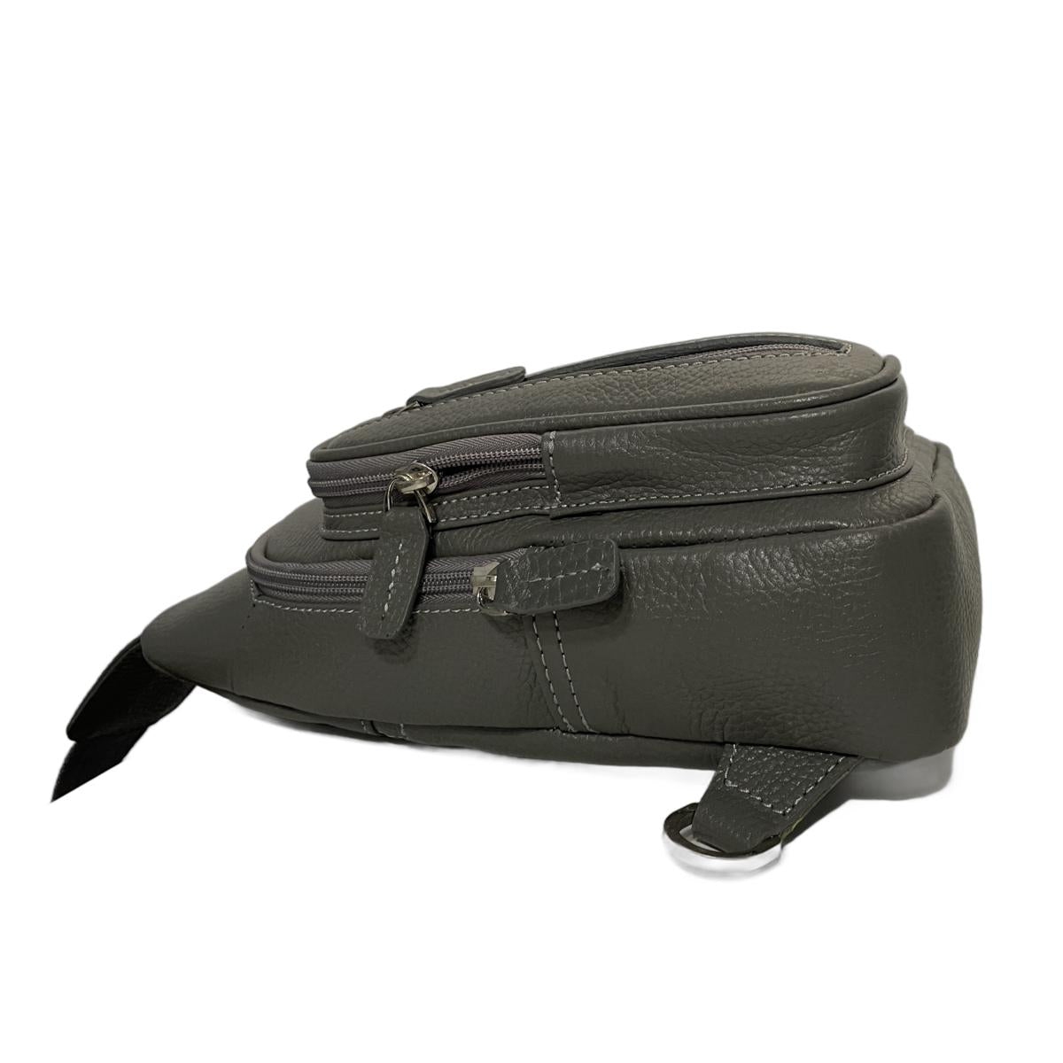 Side profile view of grey leather crossbody sling bag showing compact dimensions and sleek design