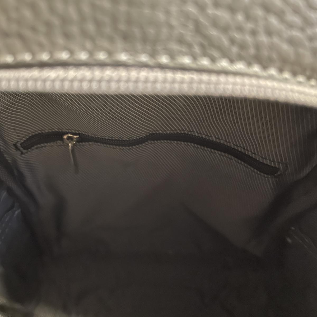 LeatherLuxe grey leather unisex bag showing versatile carrying options and modern aesthetic