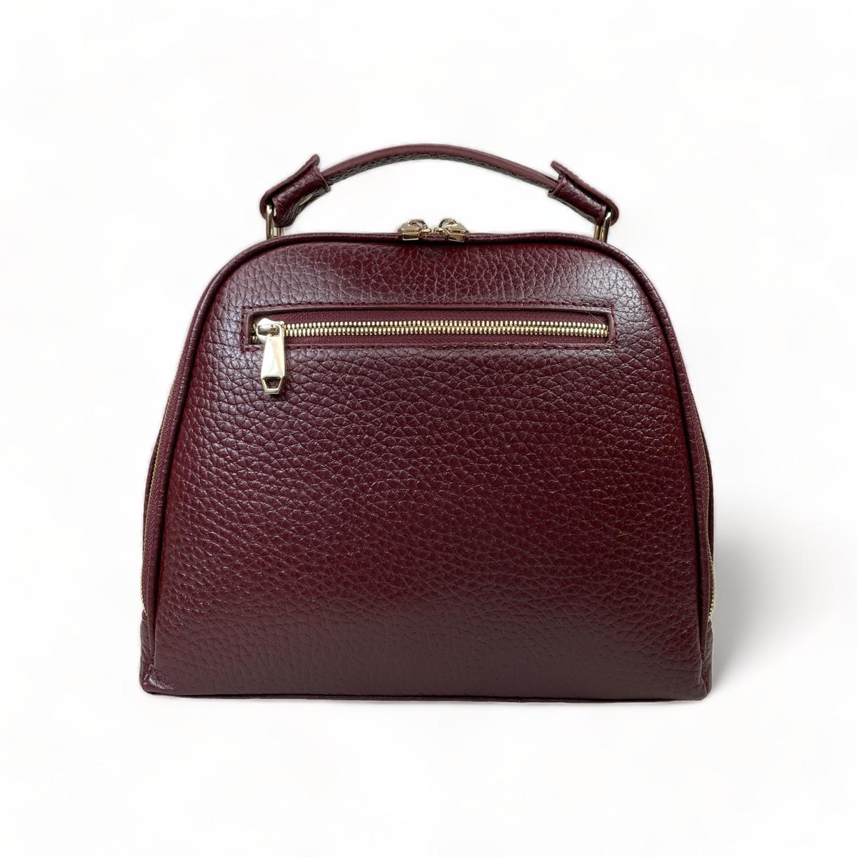 Back view of dark red leather satchel with zipped back pocket and top handle