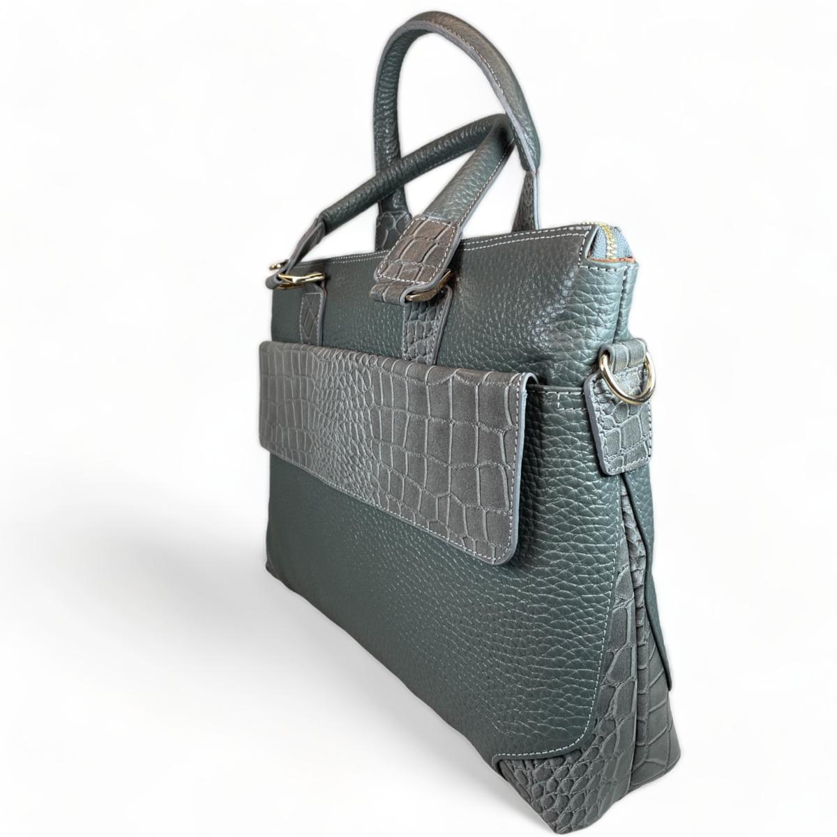 Gray leather unisex bag side profile showing structured design and handles