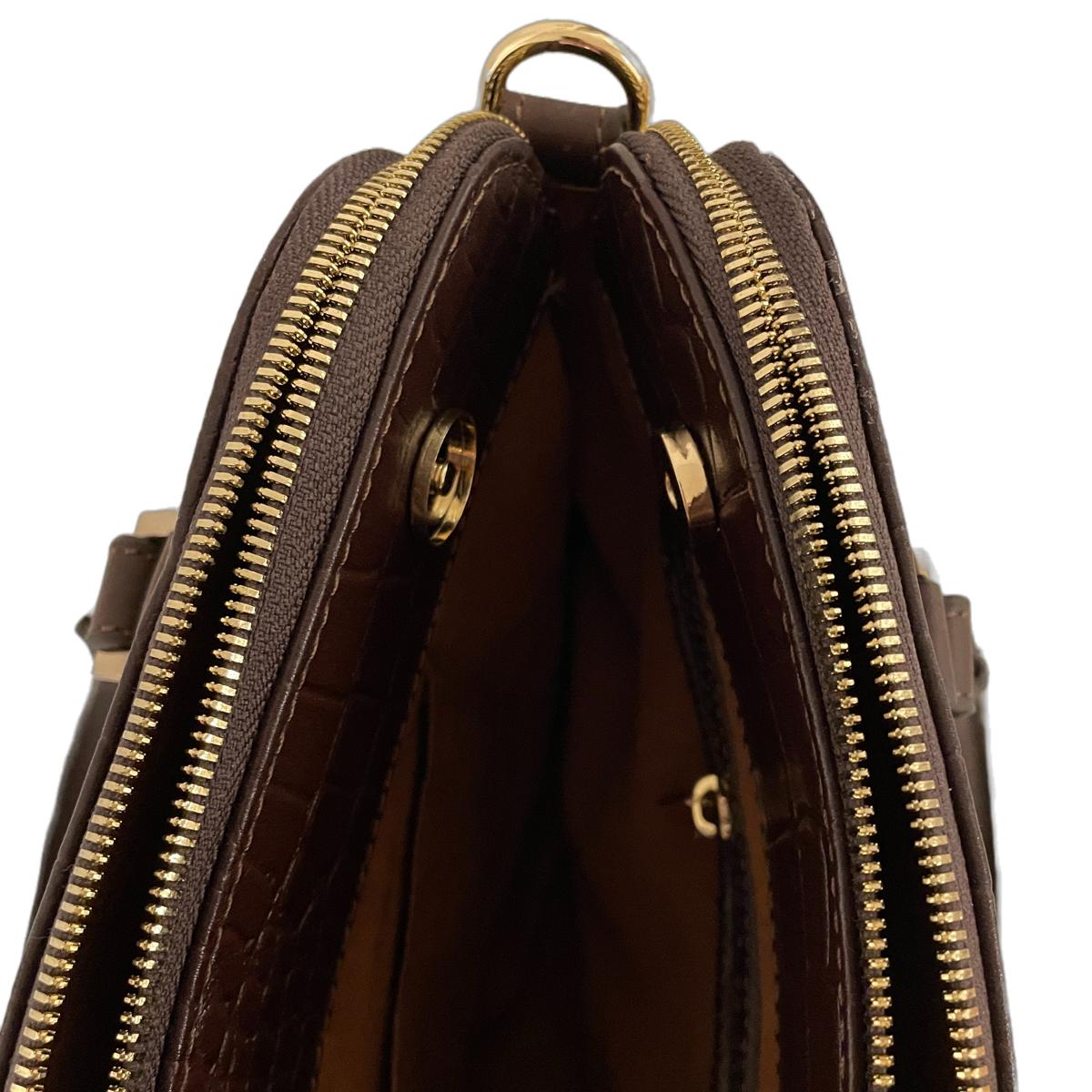 Top view of leather office bag open to show three compartments with gold zips and magnetic center lock.
