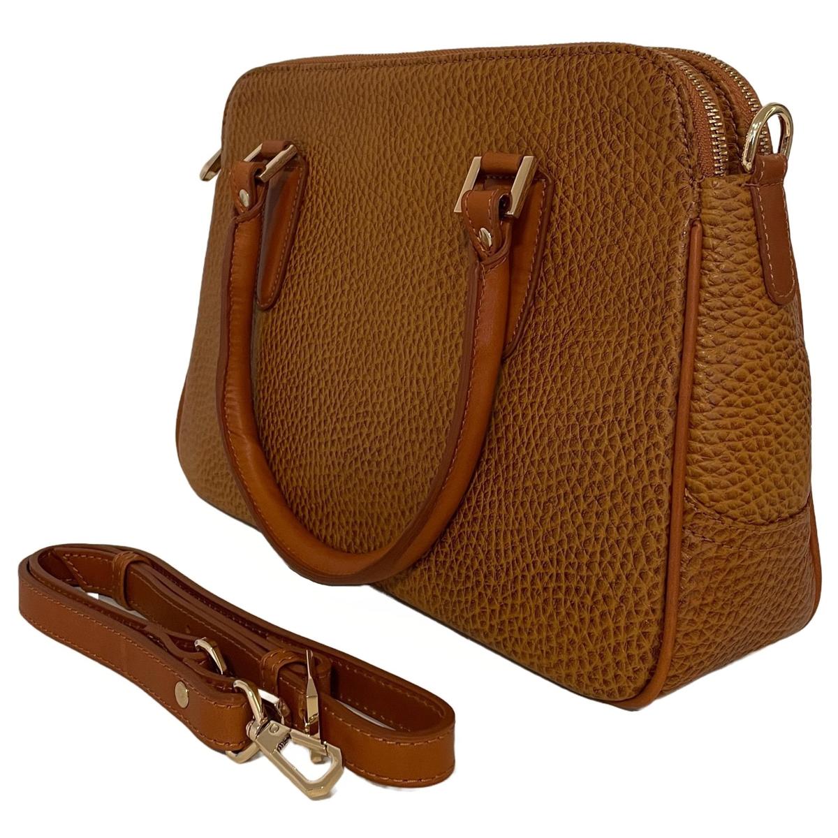 Close-up view of light brown leather office bag showing texture and craftsmanship