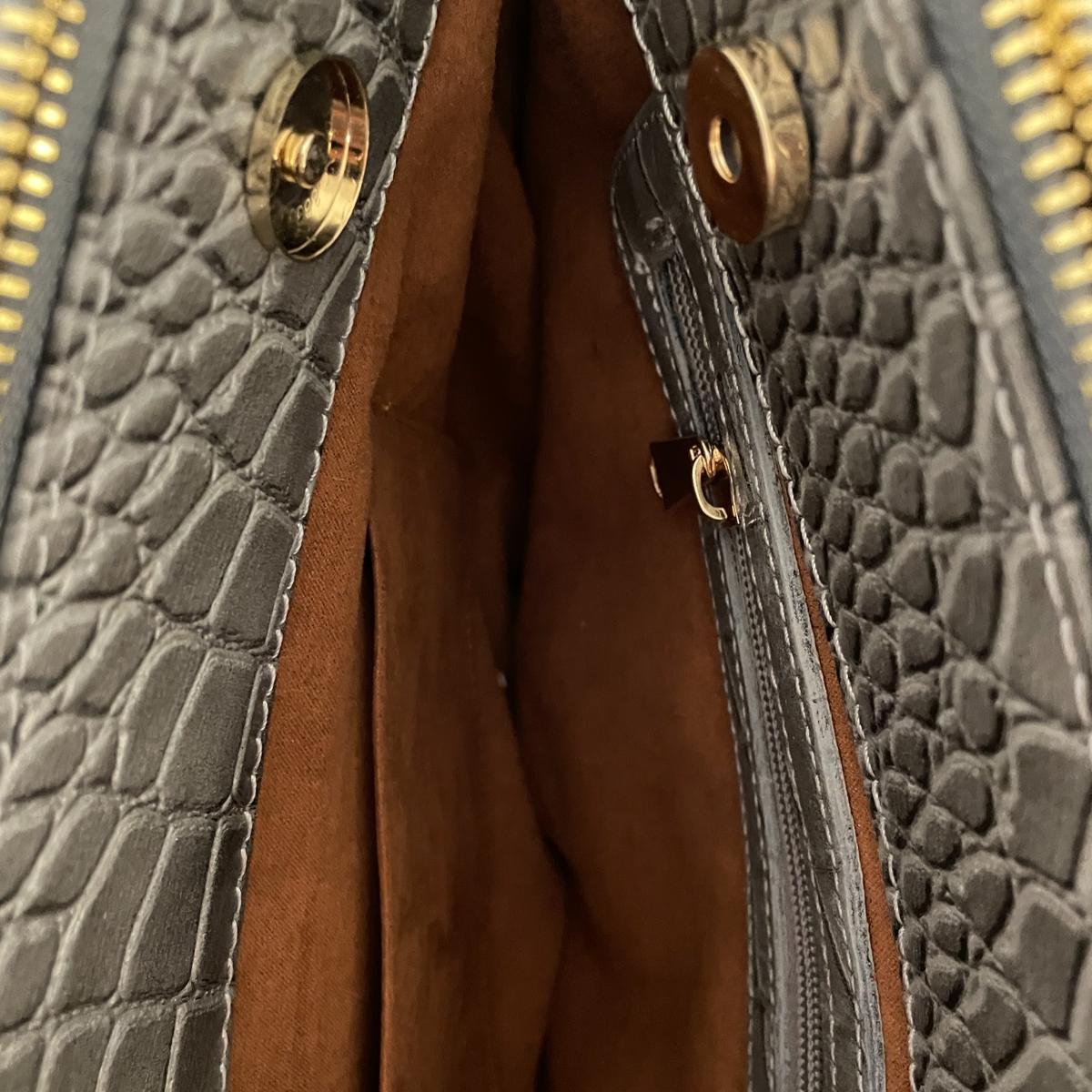 Silver leather office bag interior view displaying multiple compartments and organization