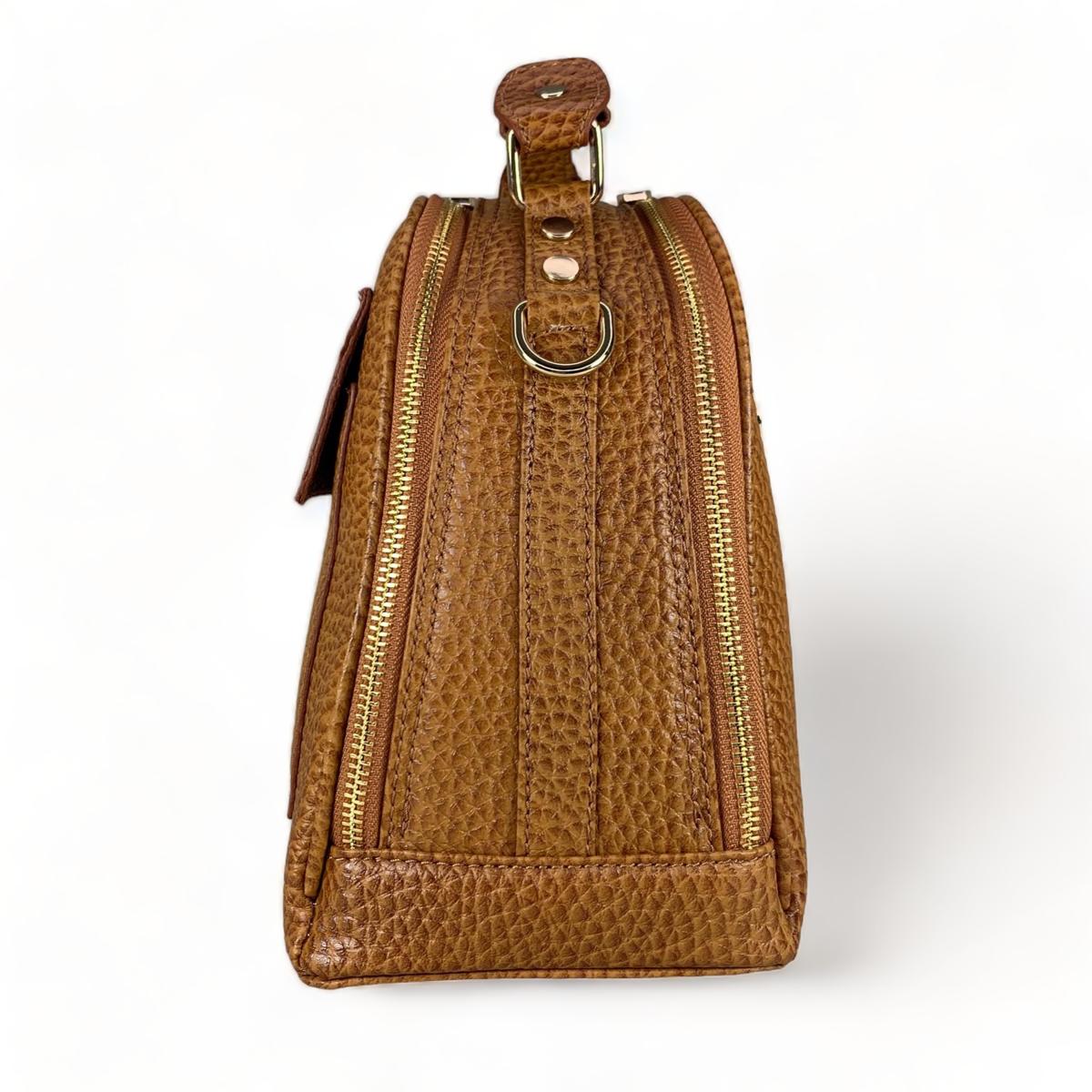 Side profile of brown leather shoulder bag showing adjustable strap and dimensions