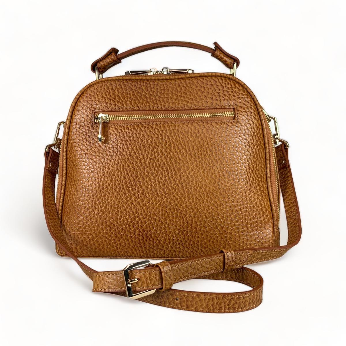 Side profile of brown leather shoulder bag showing adjustable strap and dimensions