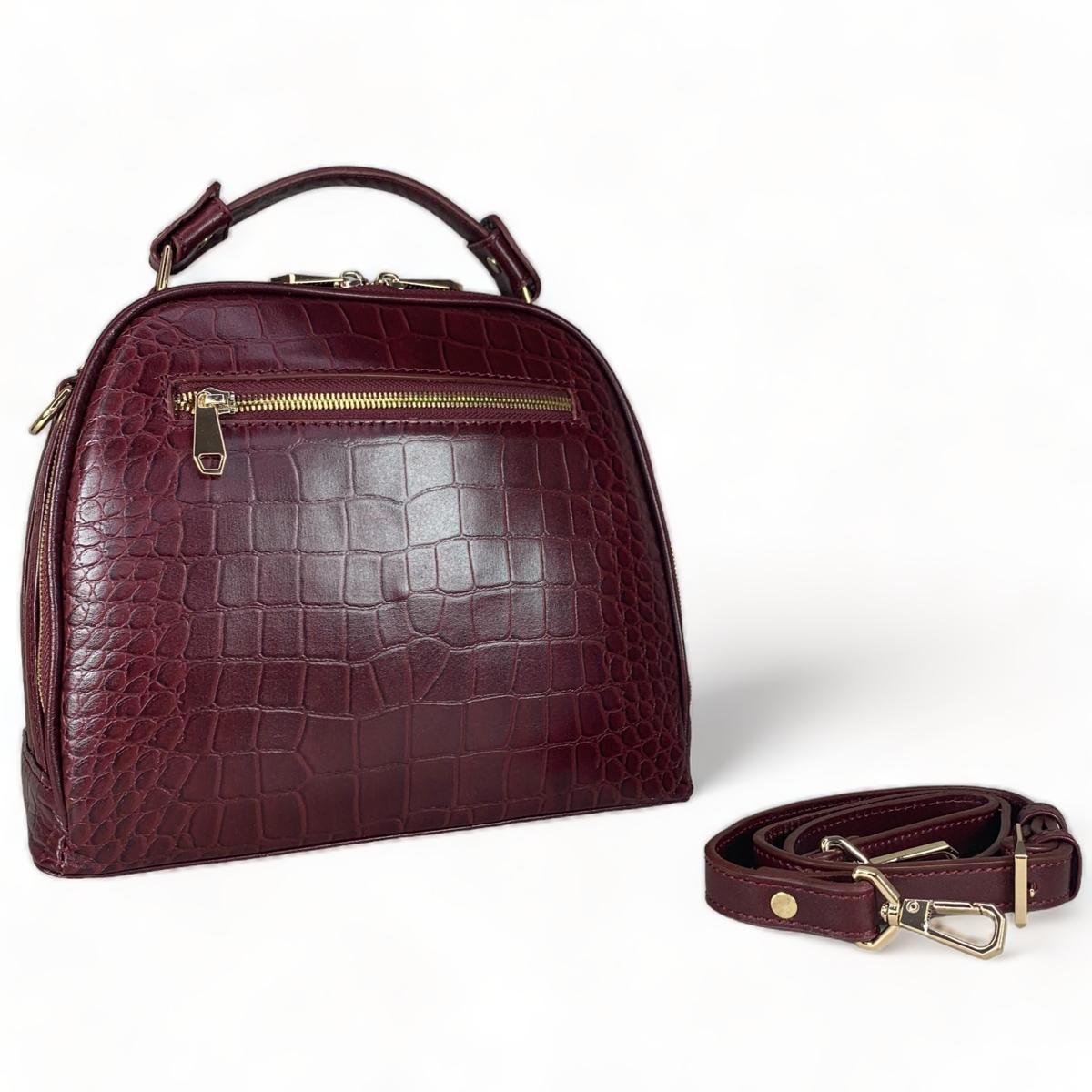 Red leather women's handbag front view showing satchel design and handles