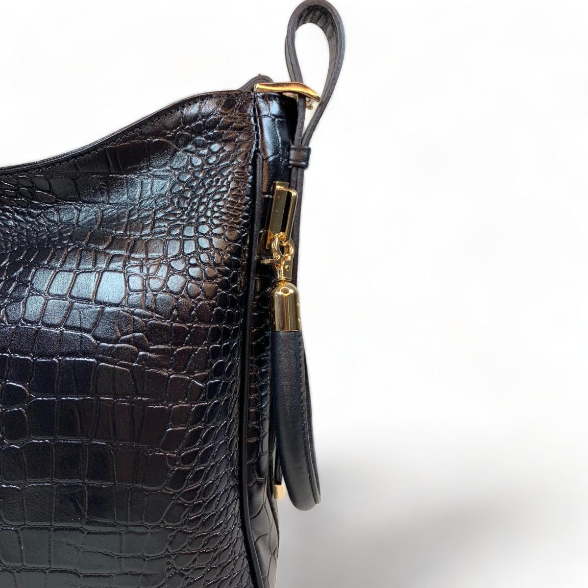 Back and side profile of black crocodile-pattern tote, standing upright
