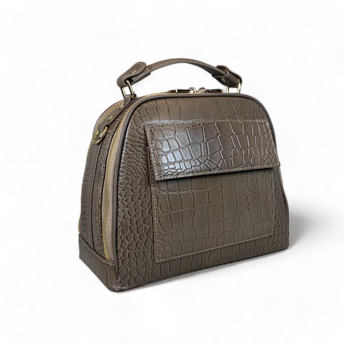 Khaki leather handbag with detachable shoulder strap displayed flat