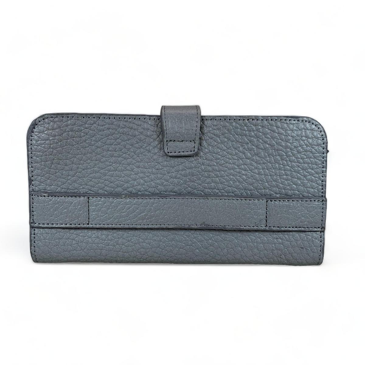 Close-up of premium hardware and stitching on gray full-grain leather clutch.