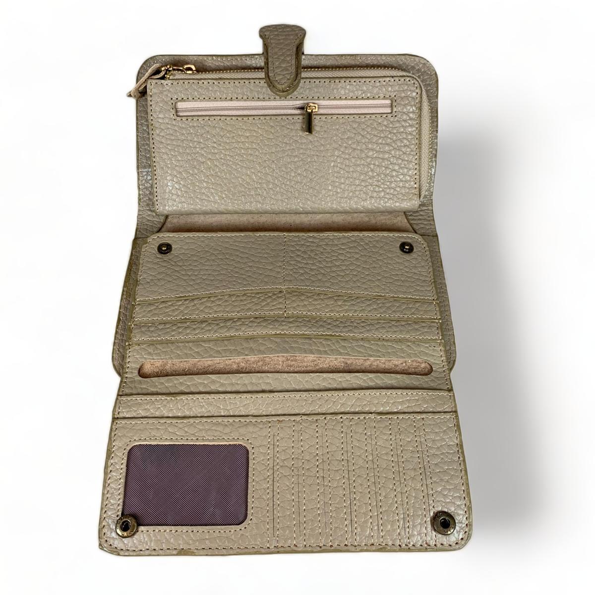 Cream leather clutch — top view highlighting secure zip closure