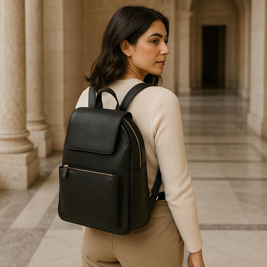 Woman wearing a black backpack in an architectural setting